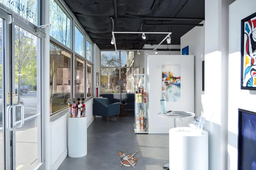 Neutral white gallery walls under track lighting, Hedlund Painting Seattle