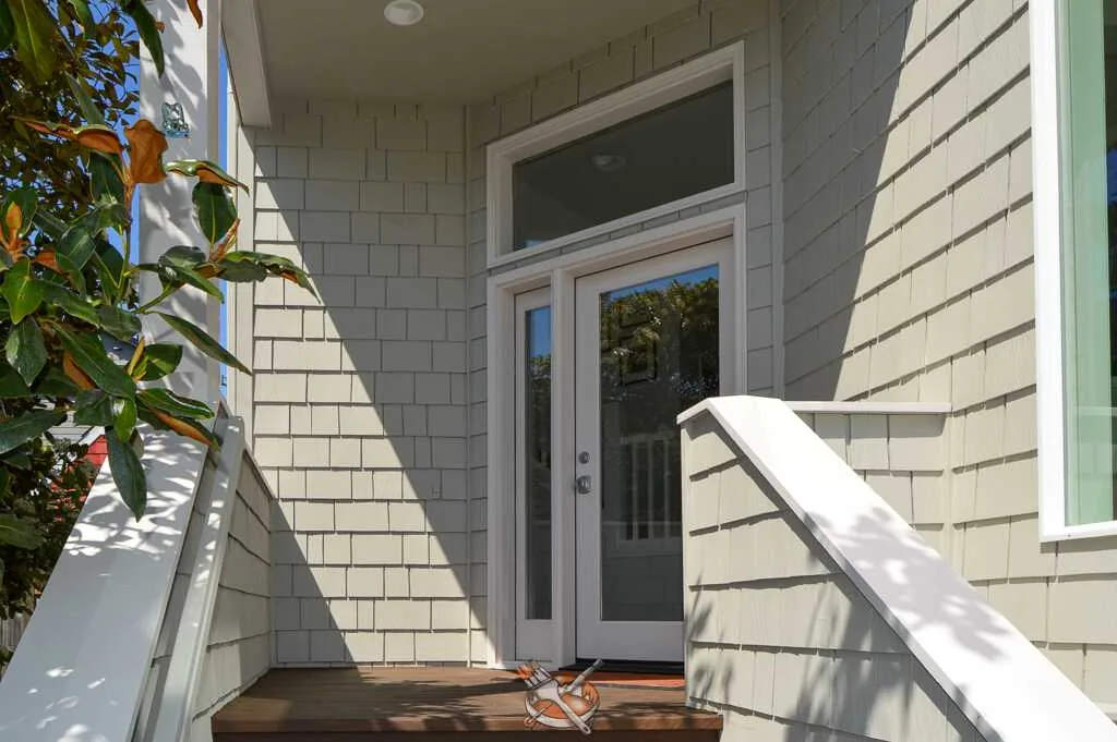 Exterior repaint by Hedlund Painting on a shingle craftsman home in Seattle, WA: side elevation