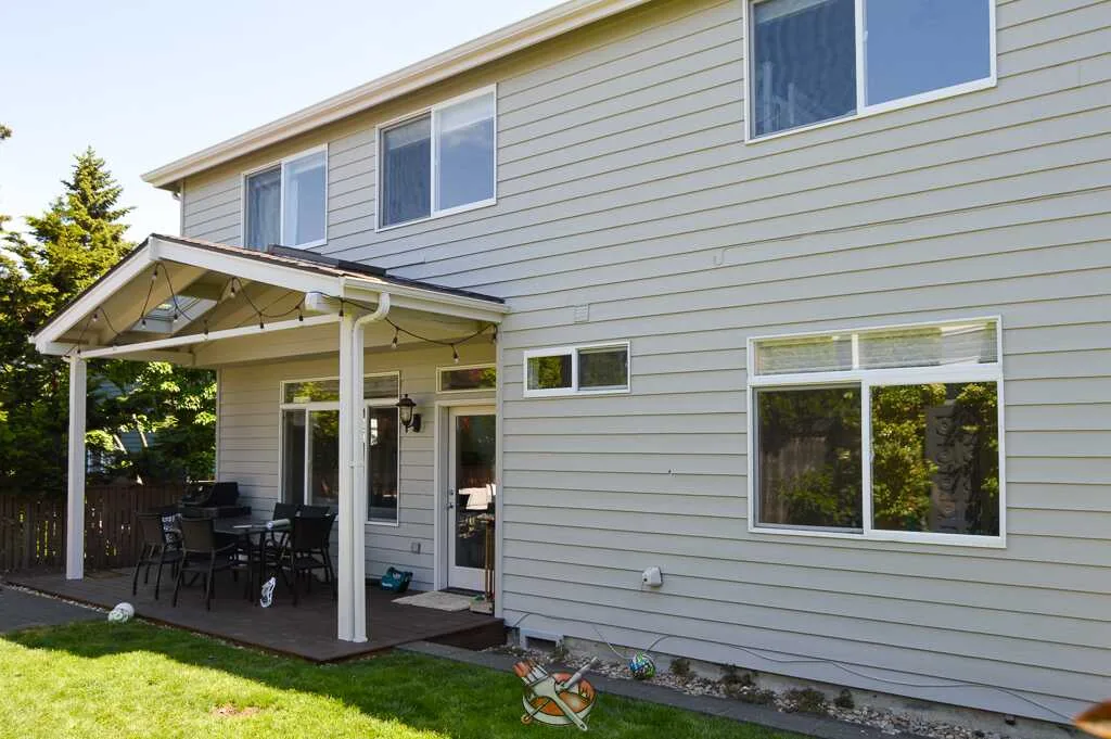 Exterior repaint by Hedlund Painting on a shingle craftsman home in Seattle, WA: upper stories