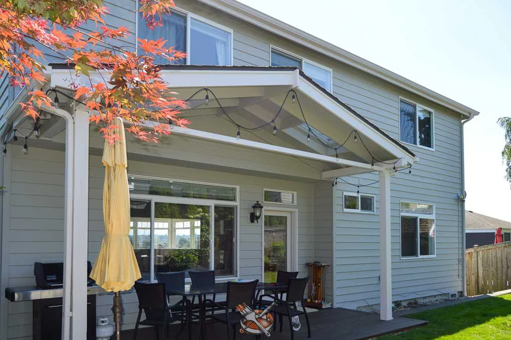 Recessed shingled entry with crisp white trim, exterior repaint by Hedlund Painting in Seattle, WA