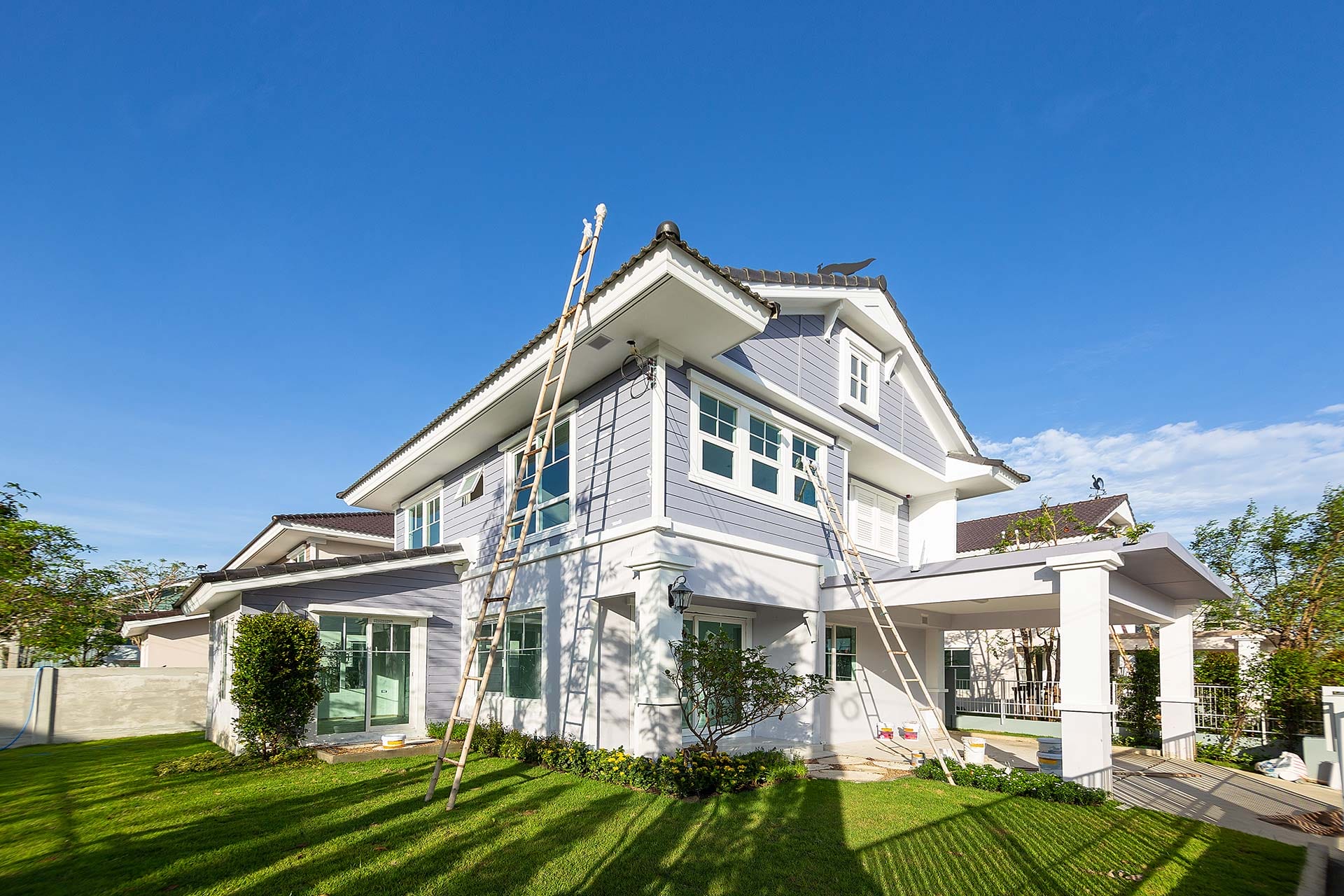 EPA Lead-Safe certified painters preparing an older shingle home in Seattle